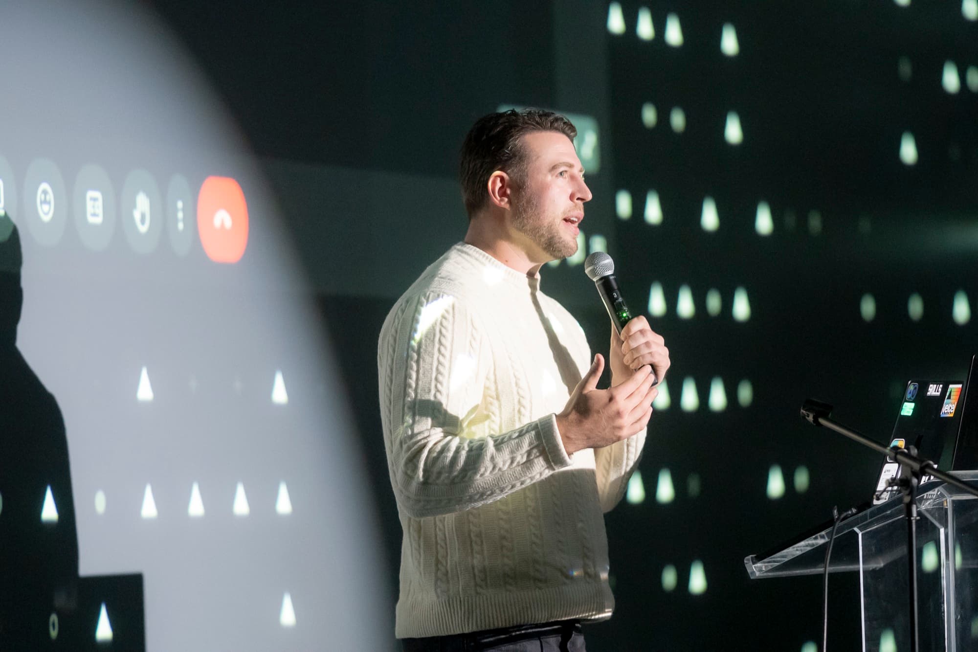 Corey Haines speaking on stage at a tech conference